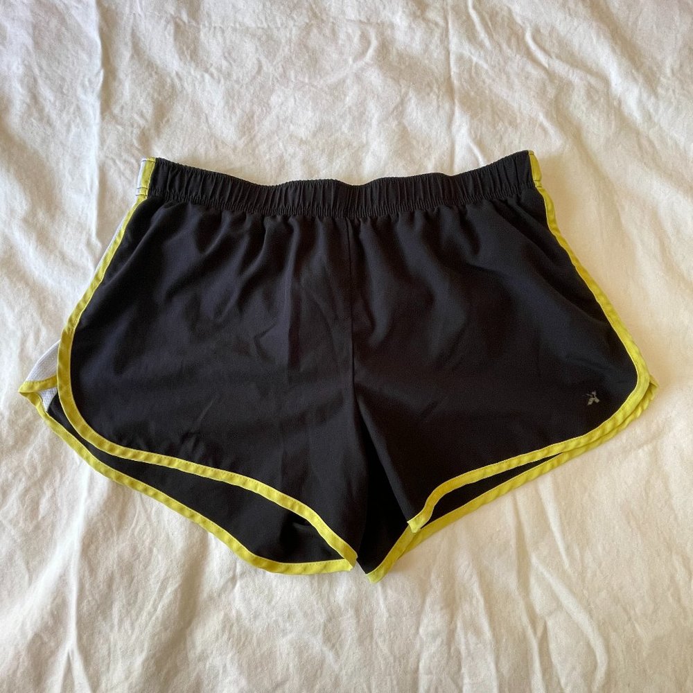 Black Athletic Dolphin Shorts with White Mesh Side Panels and Yellow Details